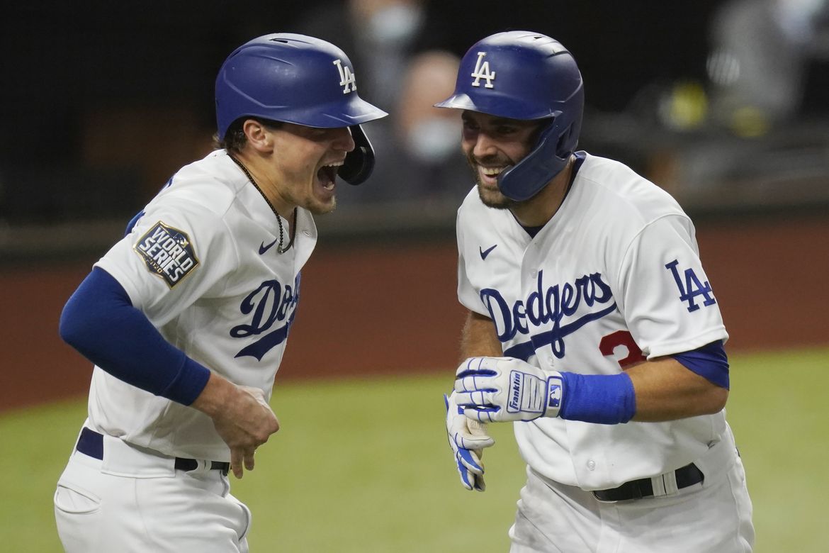 Chris Taylor of the Los Angeles Dodgers celebrates his run from a