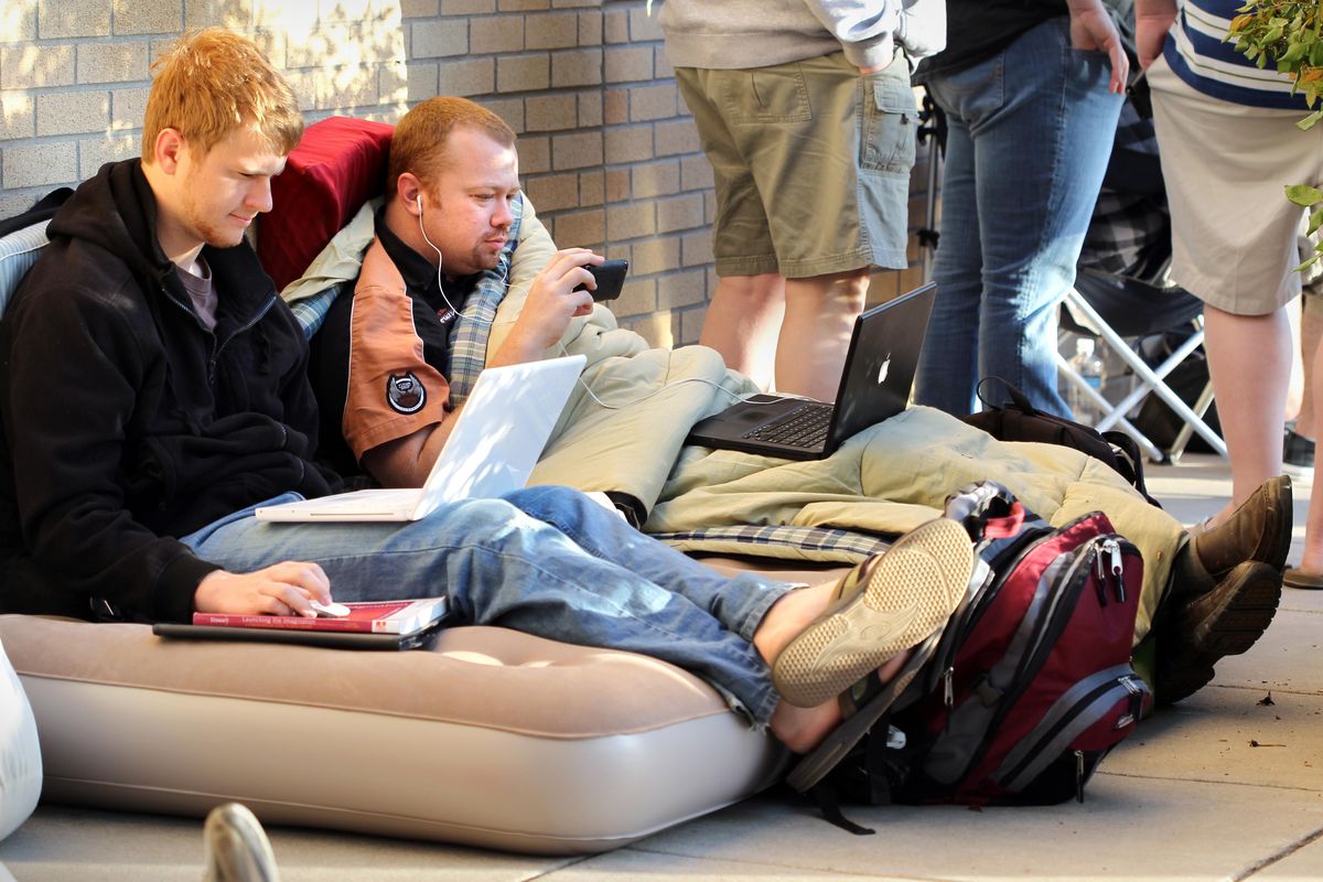 Stephen Webster, left,  and his brother Jon wait in line Saturday to purchase the iPad at an Apple Store in Dallas. Associated Press photos (Associated Press photos)