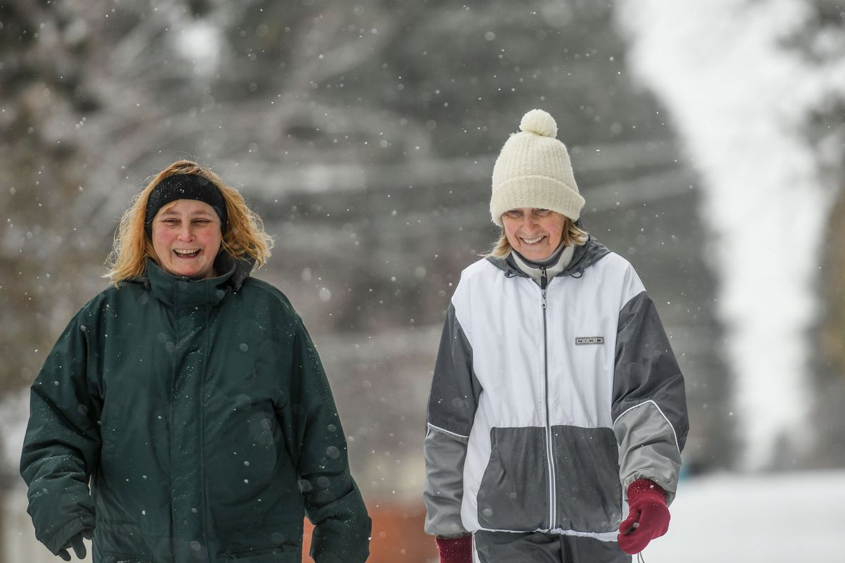“We’ve been walking together for 18 years, through cancer and everything,” says Jill Spunich, right as she walks with her friend Janeen Graham through their Spokane Valley neighborhood on Monday.  (KATHY PLONKA/THE SPOKESMAN-REVIEW)