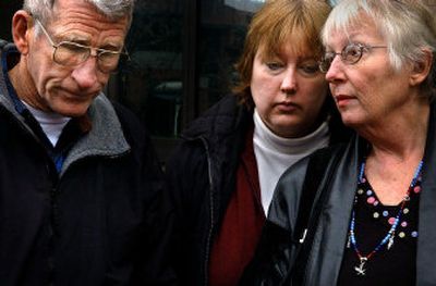 
Shannon Rhodes, right, is consoled by her daughter, Stacy Black, and her husband, Ken, after a federal jury rejected her claim against the Hanford Nuclear Reservation.
 (Jed Conklin / The Spokesman-Review)