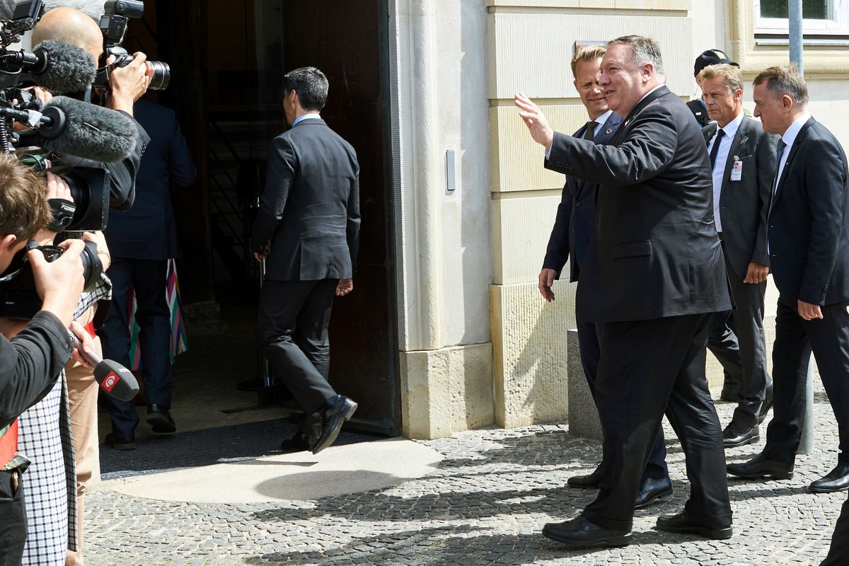 Danish Foreign Minister Jeppe Kofod, greets US Secretary of State Mike Pompeo foreground right, upon his arrival to the Ministry of Foreign Affairs, Eigtveds Pakhus, in Copenhagen, Denmark, Wednesday, July 22, 2020. Pompeo arrived in Denmark on Wednesday for meetings with the country