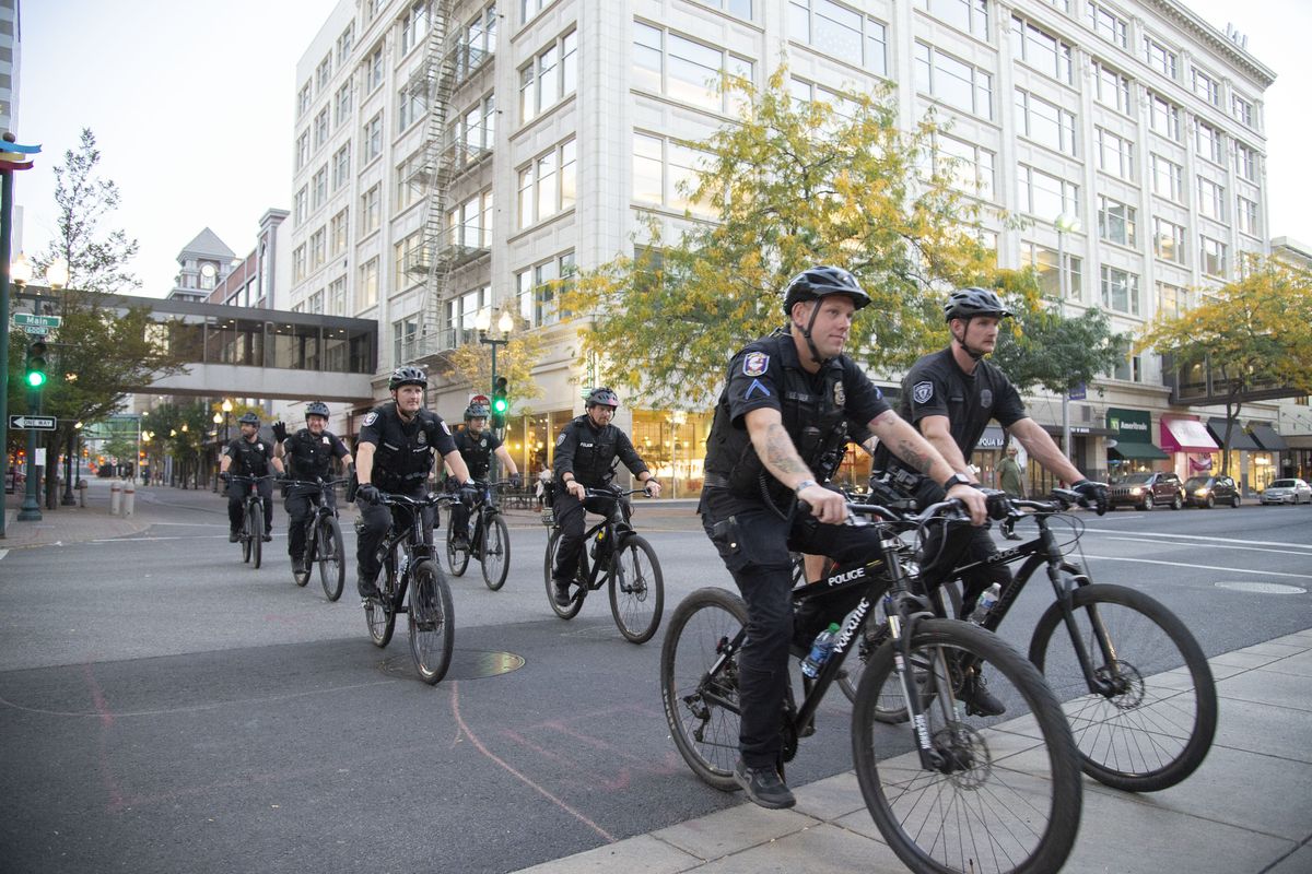 Spokane Police officers ride through the intersection at Wall Street and Main Avenue on Oct. 7, 2020.  (Jesse Tinsley/The Spokesman-Review)