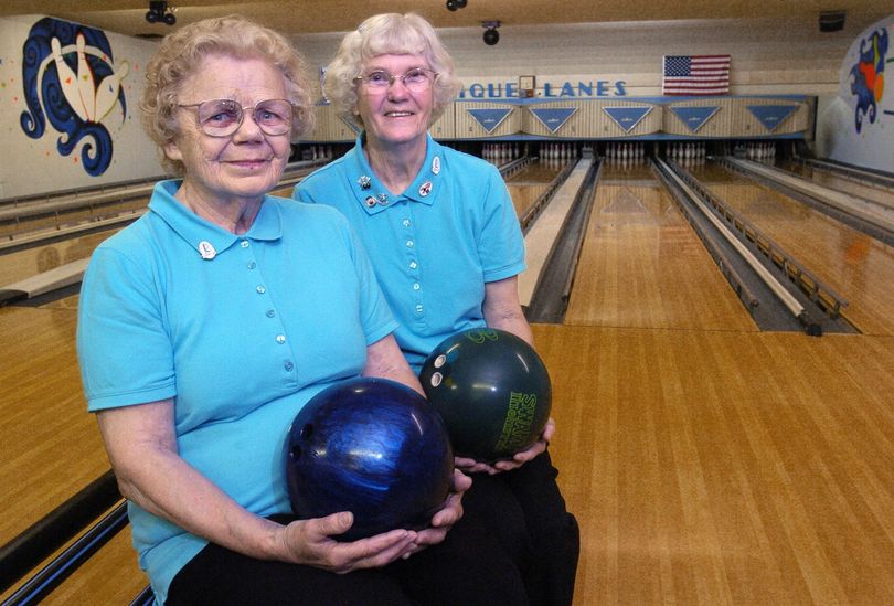ORG XMIT: MIGRA101 Emma Dausman, 86, left, and Judy Conner, 69, pose at Clique Bowling Lanes in Grand Rapids, Mich. June 11, 2009. The two great-grandmothers won the Division 2 Women's Doubles state bowling championship in May at a tournament in the Bay City area.  (AP Photo/The Grand Rapids Press, Lance Wynn) (Lance Wynn / The Spokesman-Review)