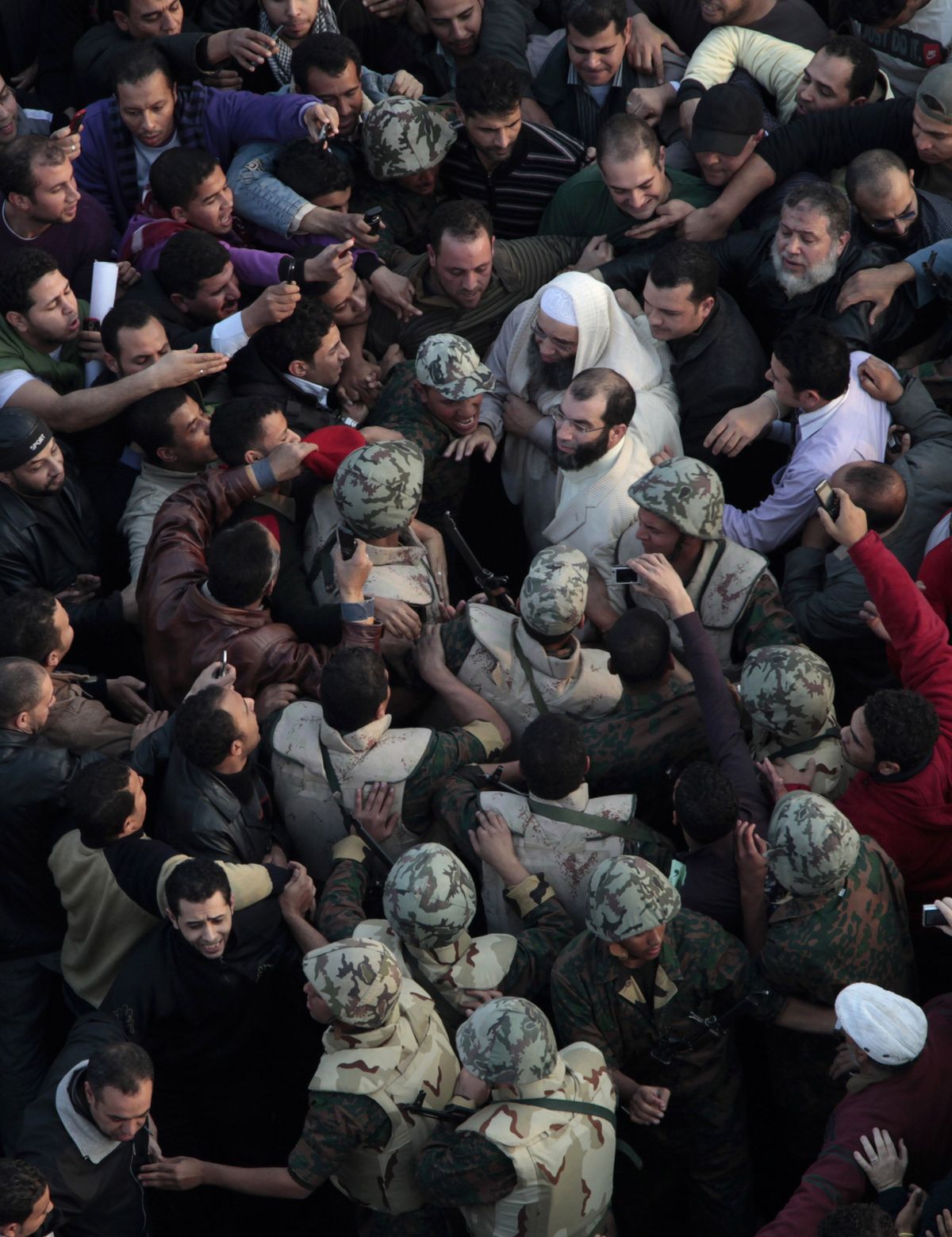 Soldiers surround an unidentified Muslim cleric, center in white, in Tahrir, or Liberation, Square in Cairo, Egypt, Tuesday, Feb. 1, 2011.  (Lefteris Pitarakis / Associated Press)