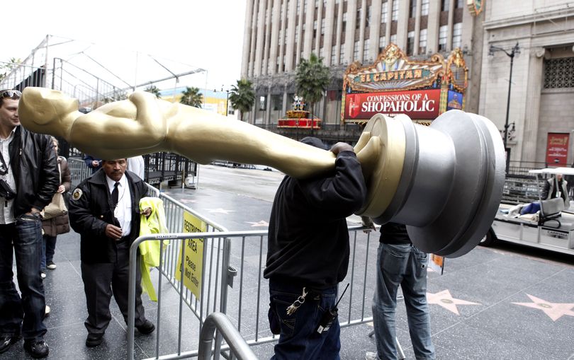 ORG XMIT: CAMW101 Production worker Frank Roach carries an Oscar statue outside of the Kodak Theatre in Los Angeles on Tuesday, Feb. 17, 2009. The 81st Academy Awards will be presented Sunday, Feb. 22. (AP Photo/Matt Sayles) (Matt Sayles / The Spokesman-Review)