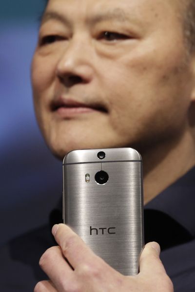 Peter Chou, CEO of HTC, introduces the HTC One (M8) on Tuesday in New York. (Associated Press)