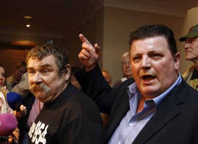 John Kelly, of  Survivors of Child Abuse,   right, and Kevin Flannagan, brother of a child abuse victim,  protest  being turned away from a press conference in Dublin, Ireland, on Wednesday.  (Associated Press / The Spokesman-Review)