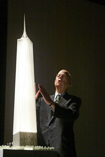 Architect David Childs speaks next to a model of the redesigned Freedom Tower during a conference Wednesday in New York to unveil the new plans for the World Trade Center site.
(Associated Press / The Spokesman-Review)