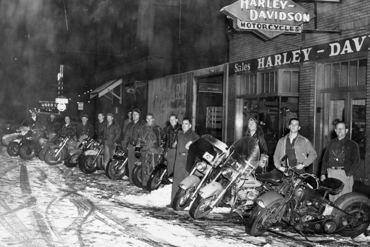 1954: The Civil Defense motorcycle group, with 85 members, trained to serve as messengers in case of disaster. George Faulders was the group chief. They are shown in front of the local Harley-Davidson dealership, Brush Cycle.