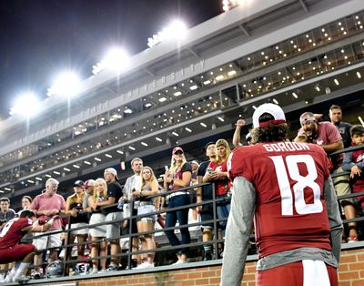Fans cheer as Washington State Cougars quarterback Anthony Gordon heads to the locker room during Washington State’s win over New Mexico State in 2019. (Tyler Tjomsland / Tyler Tjomsland/The Spokesman-Review)
