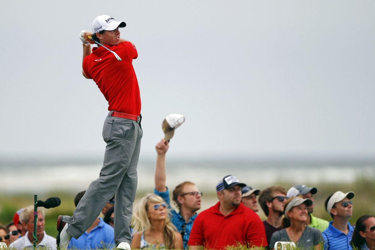 Rory McIlroy watches one of his booming drives in the final round, this one from the eighth tee. (Associated Press)