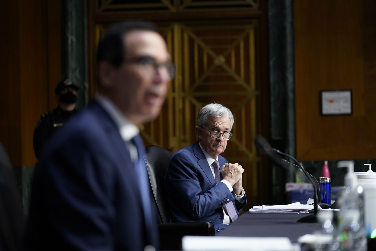 Chairman of the Federal Reserve Jerome Powell listens as Treasury Secretary Steven Mnuchin testifies during a Senate Banking Committee hearing on 