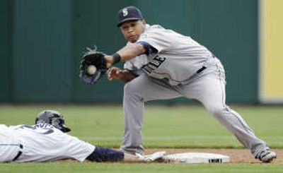 
Seattle's Jose Lopez gloves an attempted pickoff of Matt Joyce. Associated Press
 (Associated Press / The Spokesman-Review)