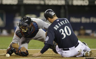 M’s Russell Branyan is safe at home in the fifth inning.  (Associated Press / The Spokesman-Review)