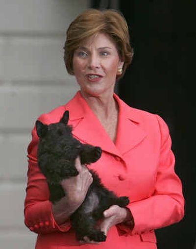 
First lady Laura Bush shows off the White House's latest puppy, Miss Beazley, a Scottish terrier.
 (Associated Press / The Spokesman-Review)