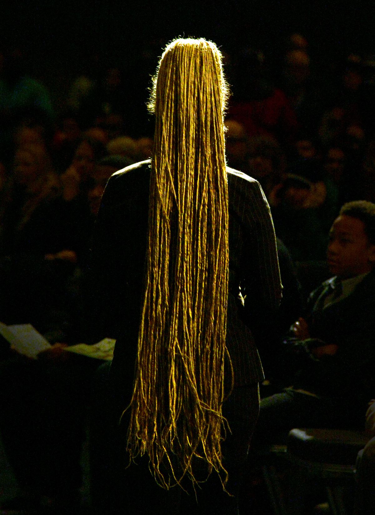 Wearing dreadlock weave hair extensions, Rachel Dolezal, president of the NAACP’s Spokane chapter, leaves the podium after speaking at a Dr. Martin Luther King Jr. rally at the Spokane Convention Center on Jan. 19. (Colin Mulvany)