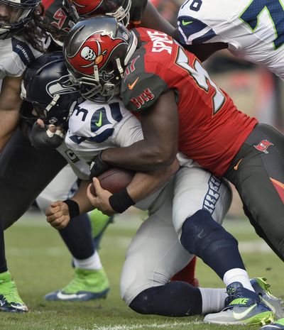 Tampa Bay sacked  Seattle’s  Russell Wilson six times last week. (Jason Behnken / Associated Press)