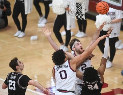 Gonzaga forward Drew Timme and wing Julian Strawther (0) battle inside against Santa Clara last January at the Leavey Center.  (TYLER TJOMSLAND/THE SPOKESMAN-REVIEW )