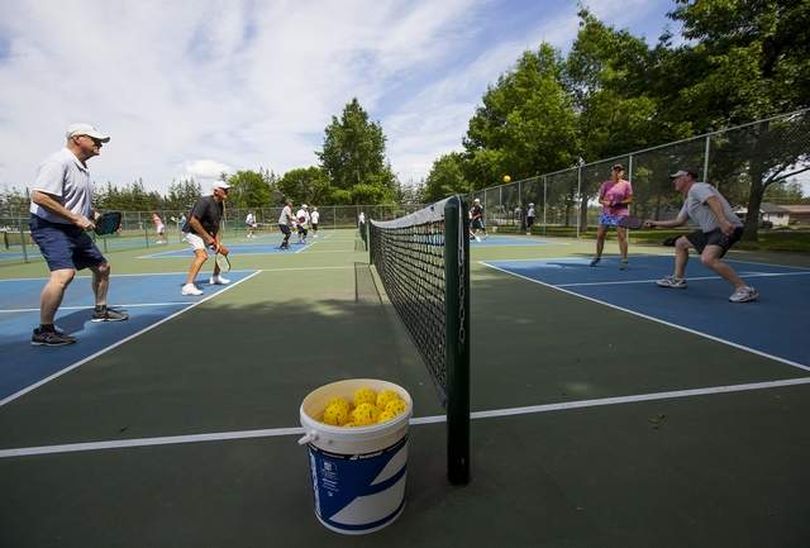 More than 25 people participated in a pickleball clinic Tuesday afternoon at Northshire Park in Coeur d'Alene. Seven years ago there were only two public pickleball courts in the area. Today, there are 27 public courts in Coeur d'Alene. (Loren Benoit/Press photo)
