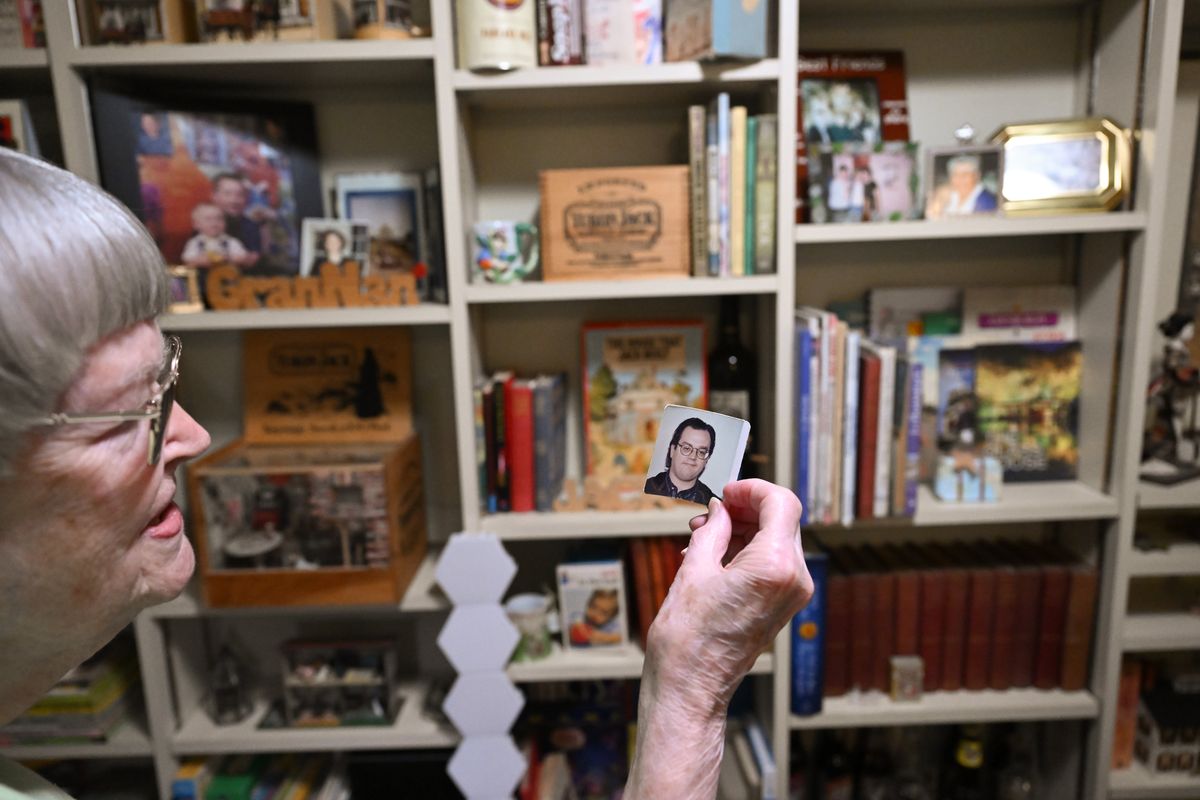 Nancy MacKerrow, who collects all things Jack related, shows a photo of her son, Jack, on Friday, Jan. 10, 2025, at her home in Spokane, Wash.  (Tyler Tjomsland/The Spokesman-Review)