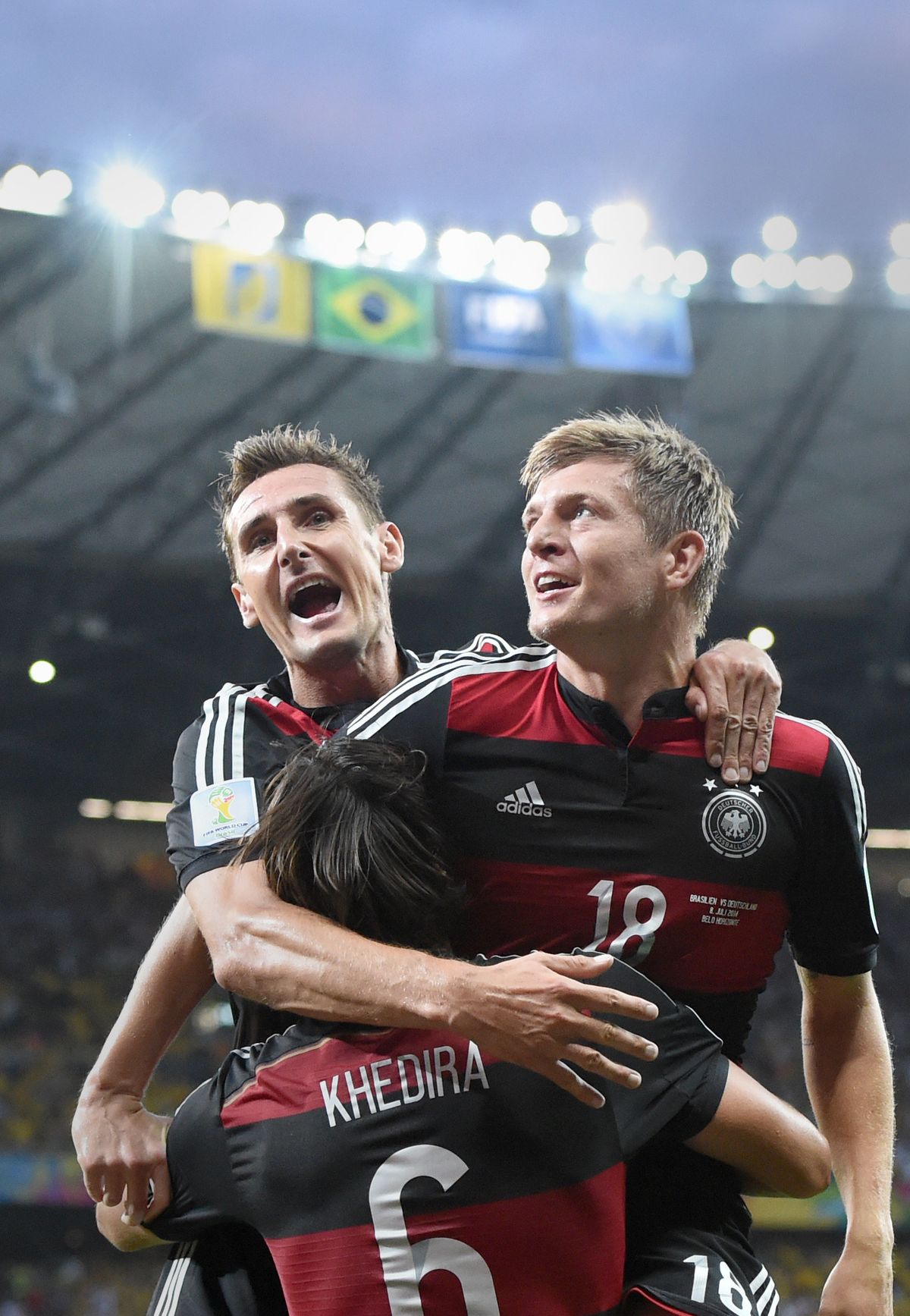 Toni Kroos, right, of Germany celebrates with Miroslav Klose, left, and Sami Khedira after a goal. (Associated Press)