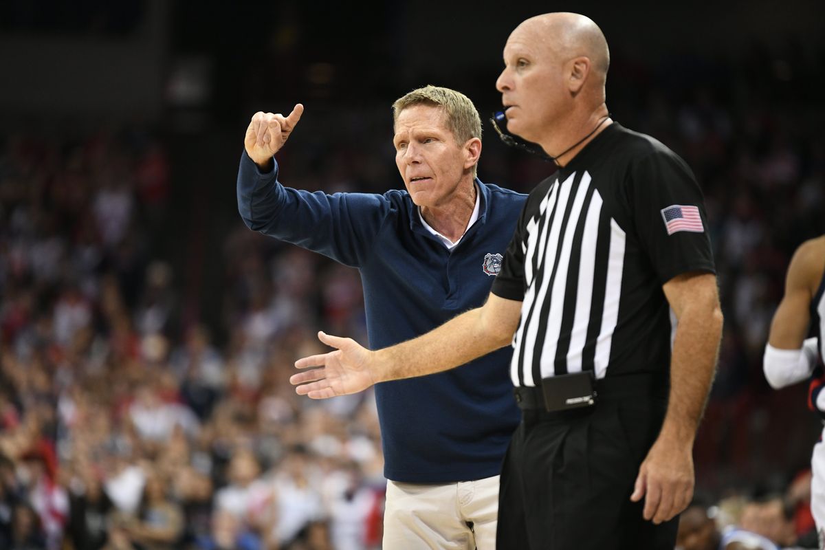 Gonzaga coach Mark Few signals to his team over the outstretched arm of an official during the Zags’ win over Kentucky on Nov. 20.  (Jesse Tinsley/The Spokesman-Review)