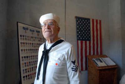 
Clyde Stone, of Bonners Ferry, stands in the Brig Museum  at Farragut State Park on Saturday. He wore his old uniform to the annual reunion there. 
 (Photos by JESSE TINSLEY / The Spokesman-Review)