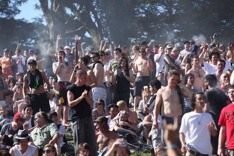 In this April 20, 2009, file photo, a large crowd cheers as the time reaches 4:20 p.m. on Hippie Hill in Golden Gate Park in San Francisco. Thursday, April 20, 2017, marks marijuana culture’s high holiday, 4/20, when college students gather - at 4:20 p.m. - in clouds of smoke on campus quads and pot shops in legal weed states thank their customers with discounts. (AP Photo/Jeff Chiu, File)