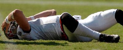 
Tampa Bay  quarterback Chris Simms holds his helmet after being tackled. 
 (Associated Press / The Spokesman-Review)
