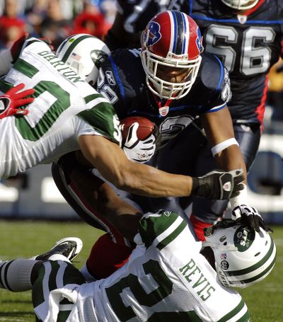 Jets linebacker Eric Barton tackles Bills running back Fred Jackson earlier this month.  (Associated Press / The Spokesman-Review)