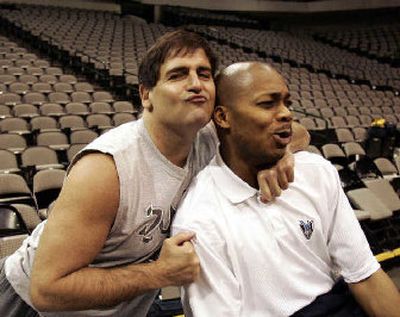 
Dallas Mavericks owner Mark Cuban, left, jokes around during his team's basketball practice in Dallas Wednesday.
 (Associated Press / The Spokesman-Review)