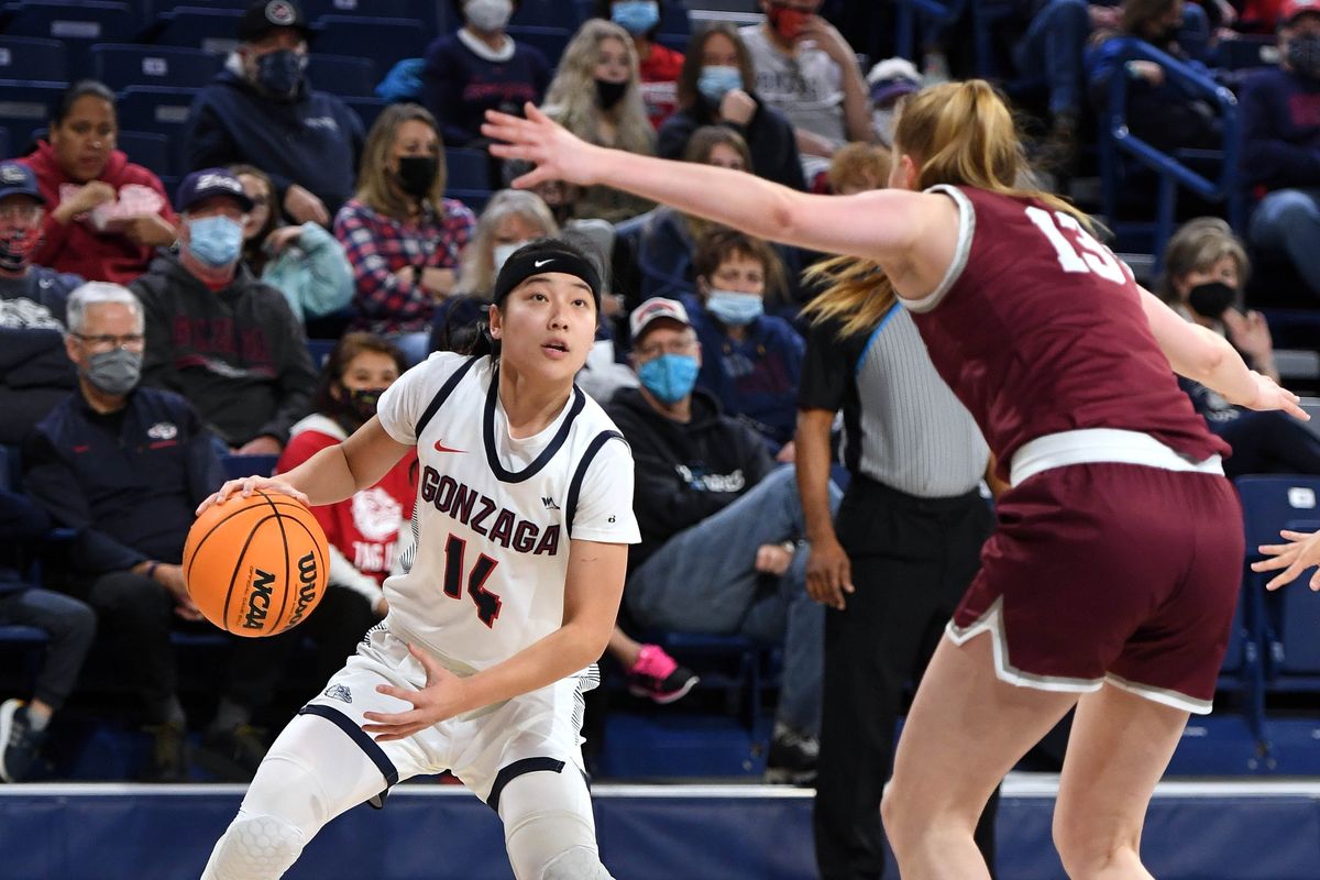 Gonzaga guard Kaylynne Truong (14) looks to pass as Santa Clara guard Lara Edmanson (13) defends during an NCAA college basketball game, Monday, Feb. 21, 2022, in the McCarthey Athletic Center.  (COLIN MULVANY/THE SPOKESMAN-REVIEW)