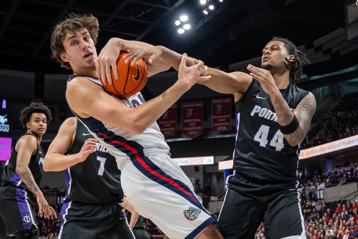 Gonzaga forward Braden Huff (34) and Portland guard Mikah Ballew (44) compete for control of the ball during a NCAA college basketball game, Thursday, Jan. 2, 2025, in the Spokane Veterans Arena.  (COLIN MULVANY)