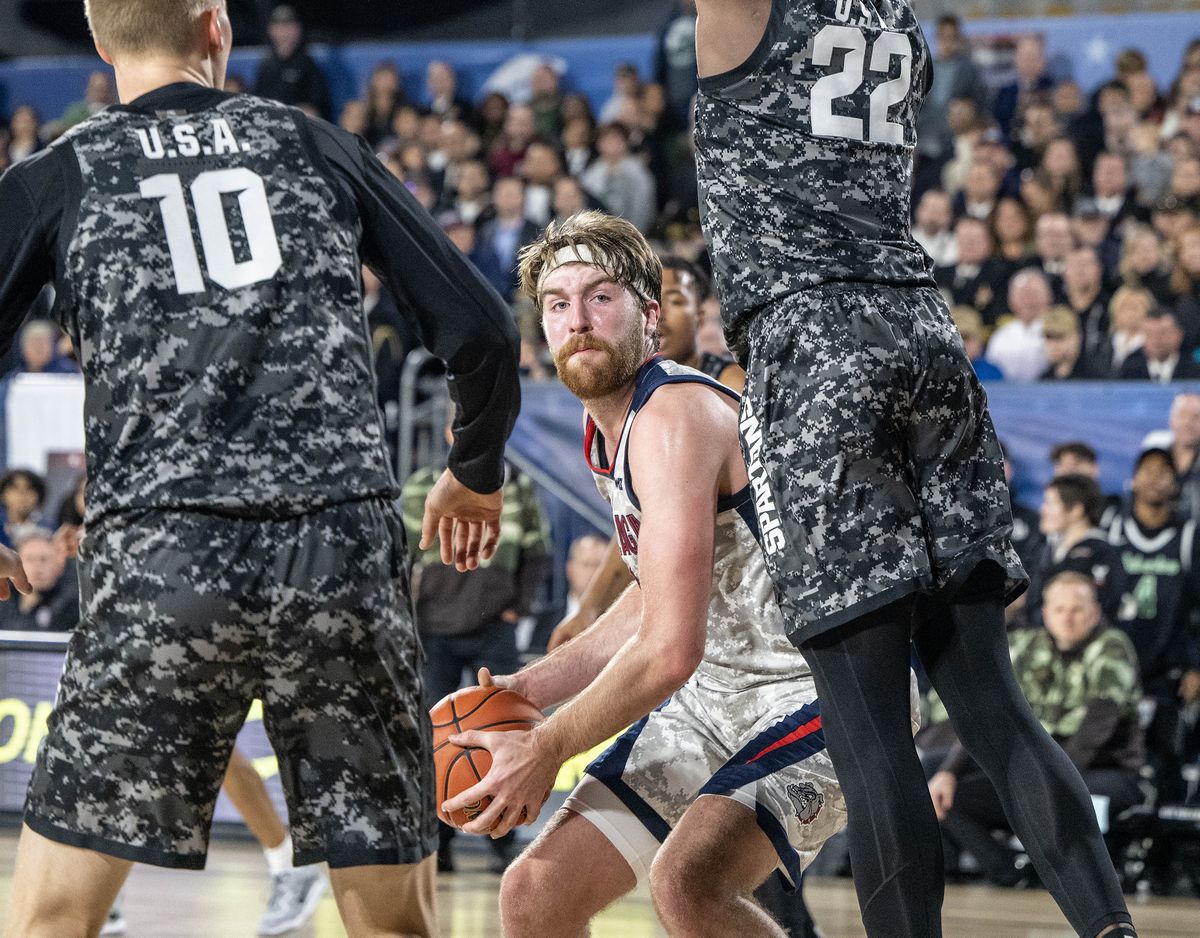 Gonzaga’s Drew Timme maneuvers inside against Michigan State forward Joey Hauser (10) and center Mady Sissoko (22) in the second half of the Armed Forces Classic on Friday.  (COLIN MULVANY/THE SPOKESMAN-REVIEW)