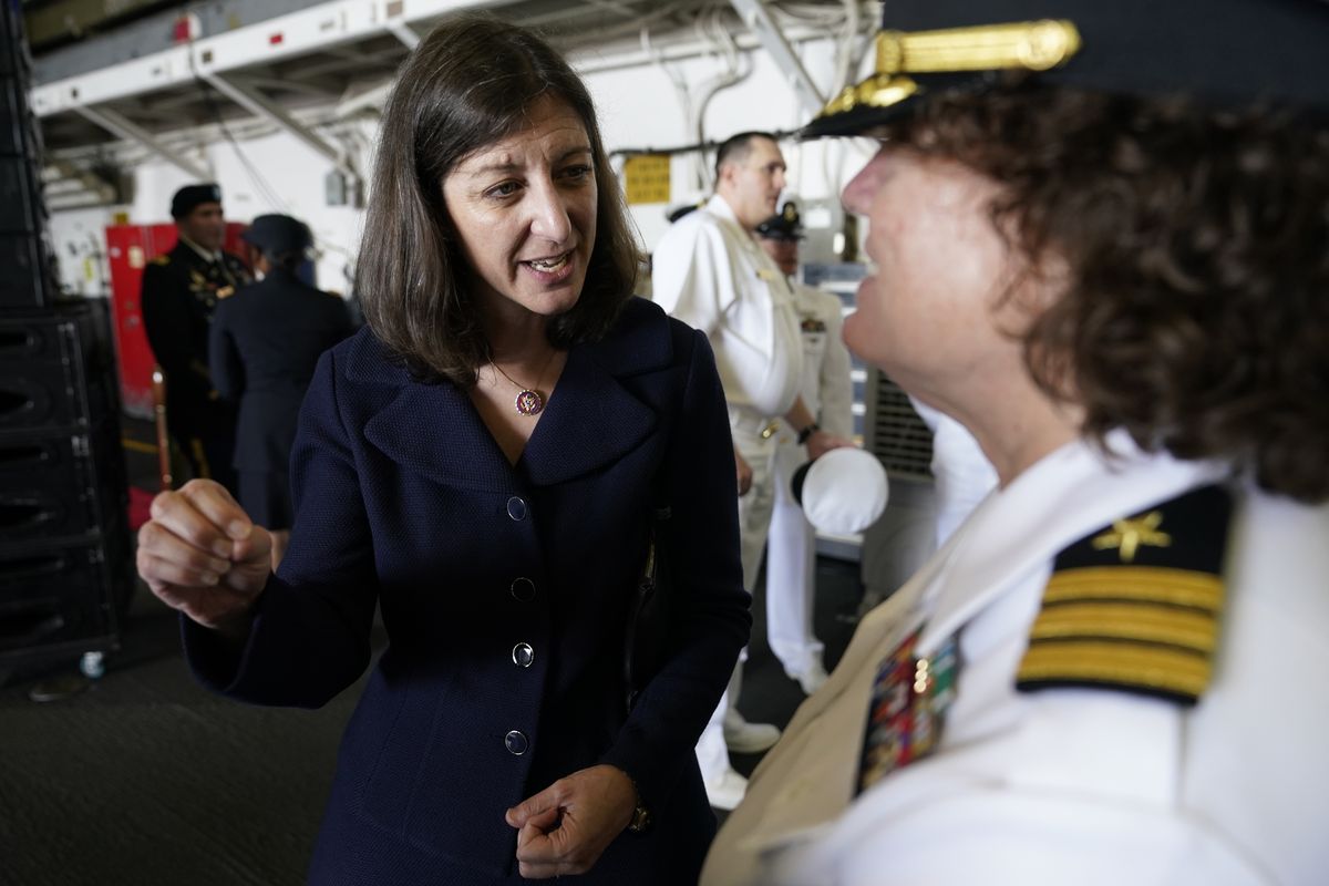 In this July 15, 2021, photo, Rep. Elaine Luria, D-Va., left, speaks to a Naval officer after a ceremony marking full operation of the NATO