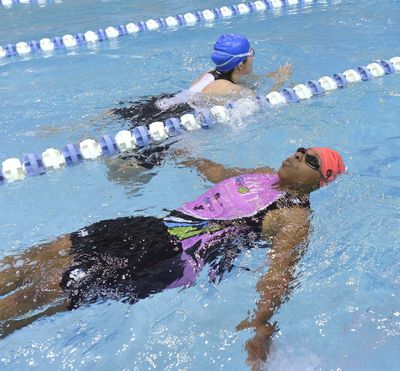 Nicole Koll, above, and Pam Christian swim laps to work on endurance in Charlotte, N.C.