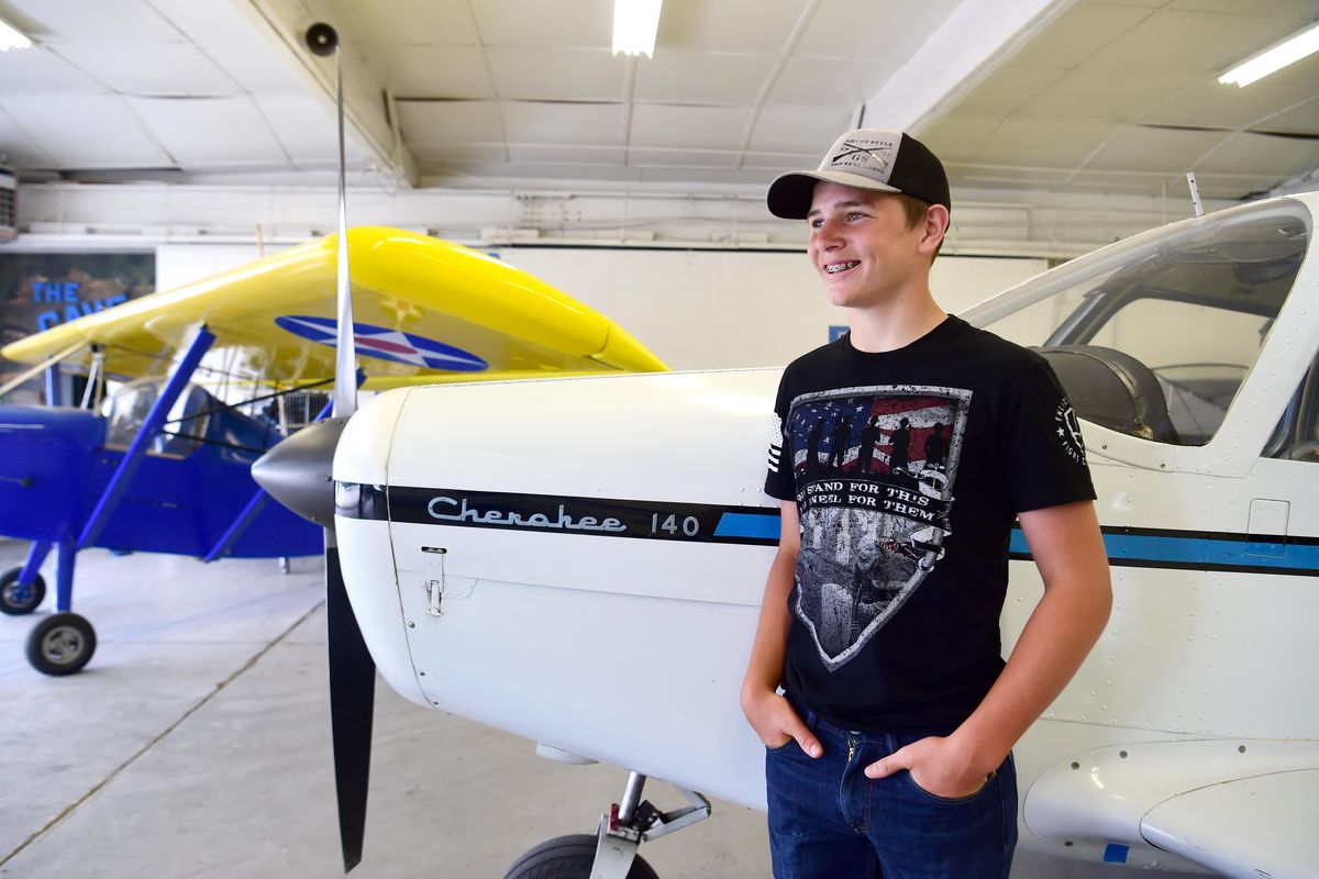 Gage Bucher, 14, has benefitted from the Young Eagles, a program offered by the Experimental Aircraft Association where pilots take young people interested in aviation up for rides in their airplanes. He is standing in the hangar of the Felts Field EAA chapter, Tuesday, July 3, 2018. (Jesse Tinsley / The Spokesman-Review)