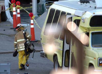 A firefighter works Wednesday at the site where five workers were killed after an explosion Tuesday at the Cabin Creek power plant in Georgetown, Colo. Associated Press
(Associated Press / The Spokesman-Review)