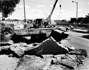 In this 1979 photo, city road crews start repair work on the Monroe Street Bridge approach which washed out, leaving a 40-foot dropoff at the south end of the bridge. The structure was to be closed at least two months for repairs, prompting a new look at plans to build a $7 million to $10 million bridge across the Spokane River at Lincoln to replace the Post Street Bridge. Meanwhile, a state financial expert in Olympia said he opposed a proposed 60-day suspension of Maple Street Bridge tolls to ease traffic congestion created by the Monroe bridge washout.  (Jim Shelton / Photo Archive Spokesman-Review)