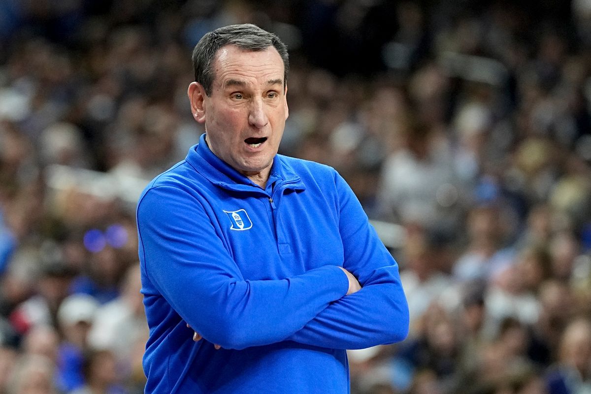 Duke head coach Mike Krzyzewski watches during the first half of a college basketball game in the semifinal round of the Men