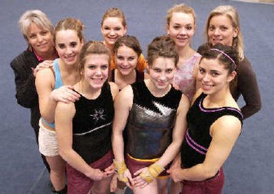 
Gymnast Tabitha Ward, center, front row, wanted to be photographed with her University High School teammates rather than by herself. She told her coach, 