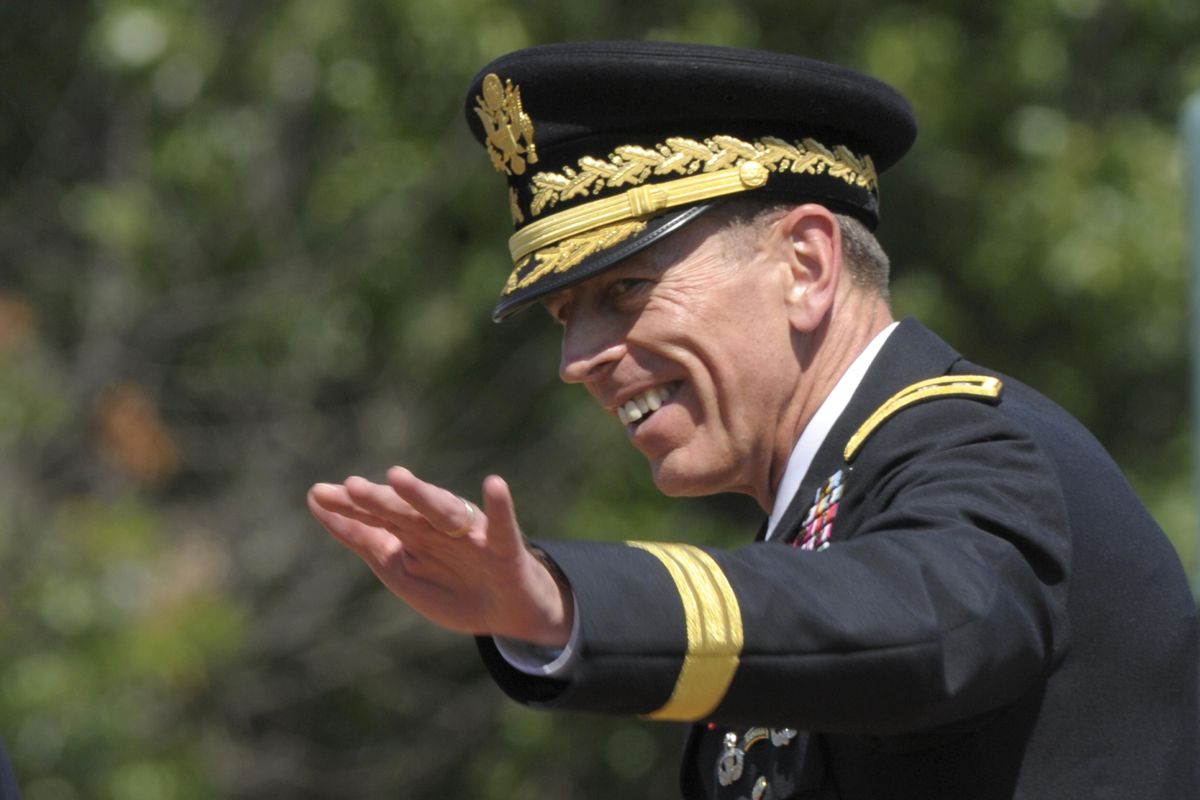 FILE – Former Commander of International Security Assistance Force and U.S. Forces-Afghanistan Gen. Davis Petraeus waves after an armed forces farewell tribute and retirement ceremony at Joint Base Myer-Henderson Hall in Arlington, Va., Wednesday, Aug. 31, 2011. (Susan Walsh / AP)