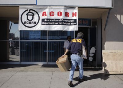 An investigator enters the ACORN office in Las Vegas on Tuesday as part of an investigation into charges of voter fraud.  (Associated Press / The Spokesman-Review)