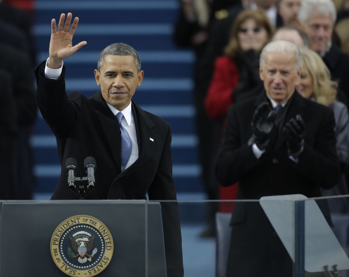 President Barack Obama waves after his speech while Vice President Joe Biden applauds at the ceremonial swearing-in at the U.S. Capitol during the 57th presidential inauguration in Washington on Monday. (Associated Press)