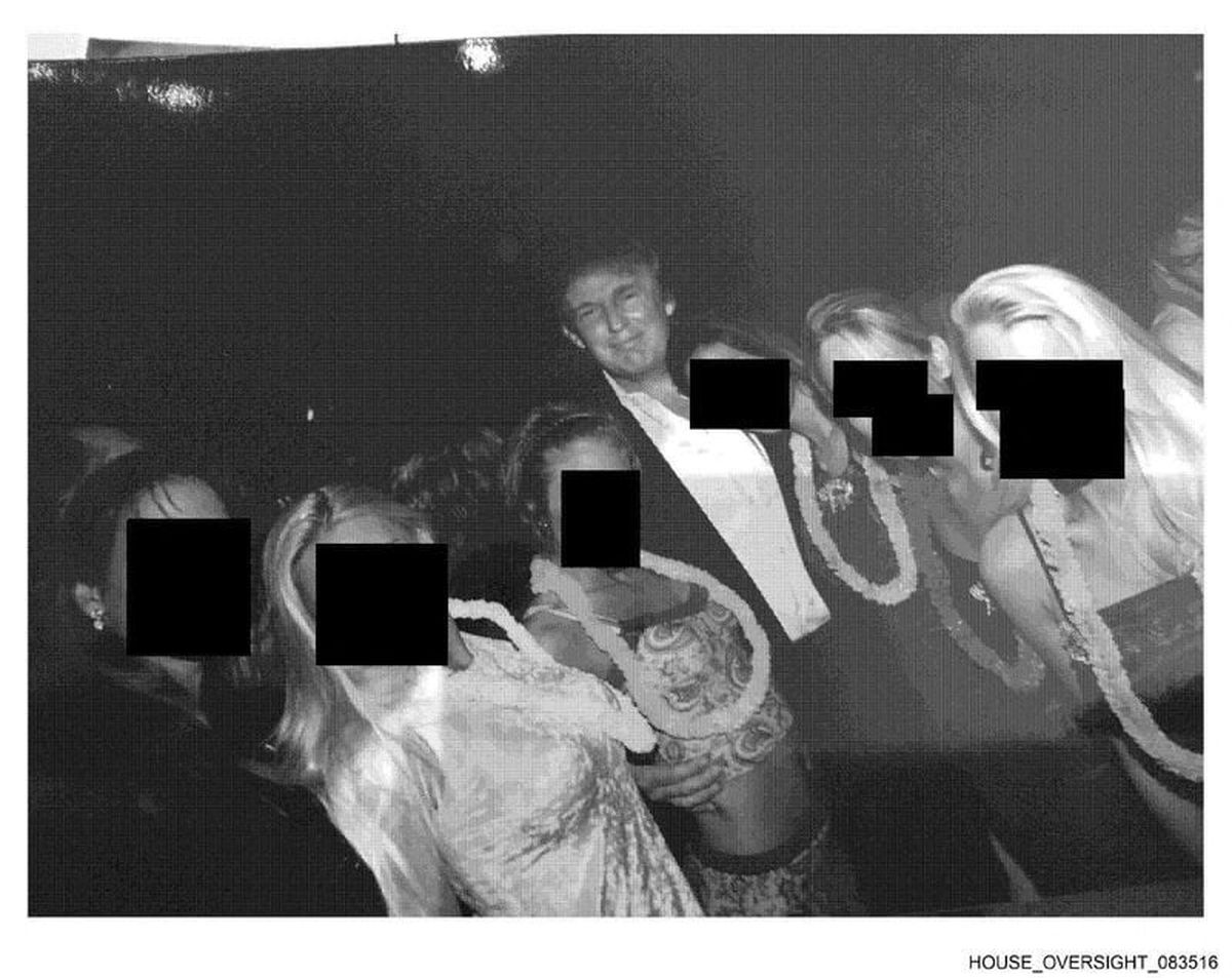 U.S. President Donald Trump poses with unidentified women in this handout image from the estate of the late financier and convicted sex offender Jeffrey Epstein, released by Democrats on the House Oversight Committee in Washington, D.C., U.S., on December 12, 2025. (House Oversight Committee Democrats/Handout via REUTERS)