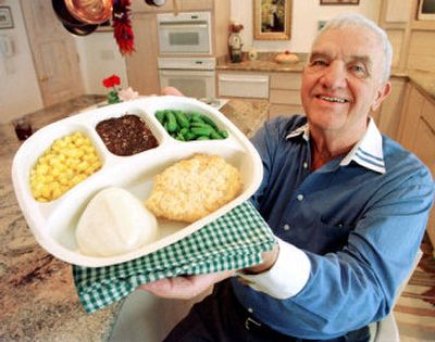 
TV dinner innovator Gerry Thomas displays a present-day version of his invention at his home in this Oct. 25, 1999, file photo, in Paradise Valley, Ariz. Thomas died Monday after a long bout with cancer.
 (Associated Press / The Spokesman-Review)
