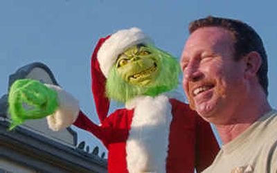 
Alan Aerts talks Wednesday about the 10-foot-tall singing Grinch he and his wife put in front of their home in Monte Sereno, Calif.
 (Associated Press / The Spokesman-Review)