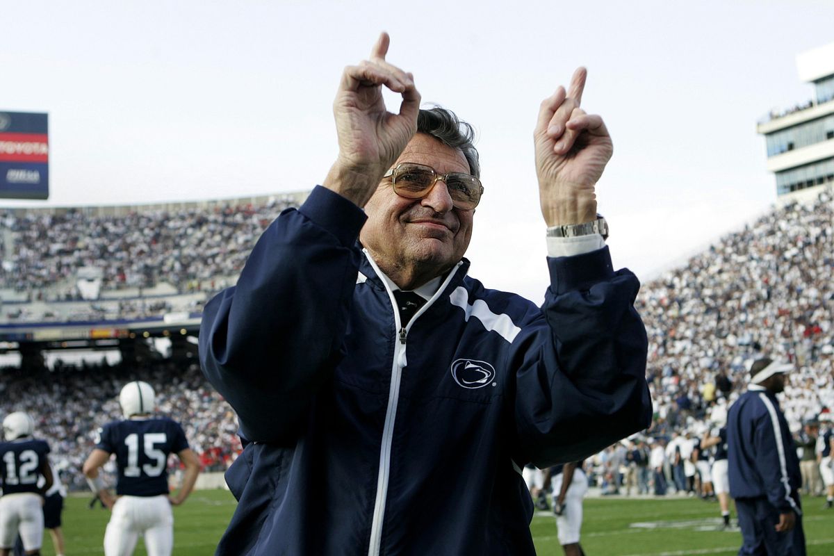FILE - In this Nov. 5, 2005, file photo, Penn State football coach Joe Paterno acknowledges the crowd during warm-ups before an NCAA college football game against Wisconsin in State College, Pa. “Paterno” aims to tell the polarizing story of a legend’s fall, when the most essential question can never be answered. The HBO movie directed by Barry Levinson debuts April 7 and stars Oscar winner Al Pacino as Joe Paterno, the Penn State coach whose career ended in scandal. (AP Photo/Carolyn Kaster, File) (Carolyn Kaster / AP file)