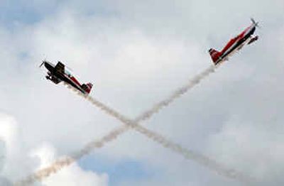 
Team OK3 Air concludes more than 3 hours of aerobatic action by vintage and modern aircraft during Thunder Over the Prairie, an air show at the Coeur d'Alene Airport in Hayden Saturday afternoon. The show will repeat Sunday starting at 11 a.m. 
 (Tom Davenport/ / The Spokesman-Review)