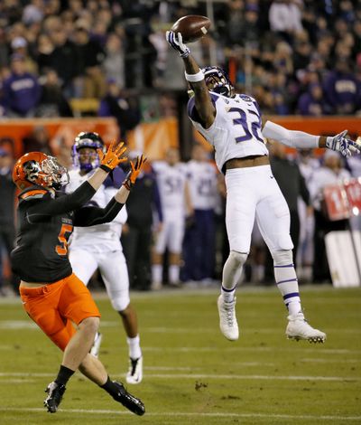 Washington free safety Budda Baker, right, started every game last season. (Associated Press)